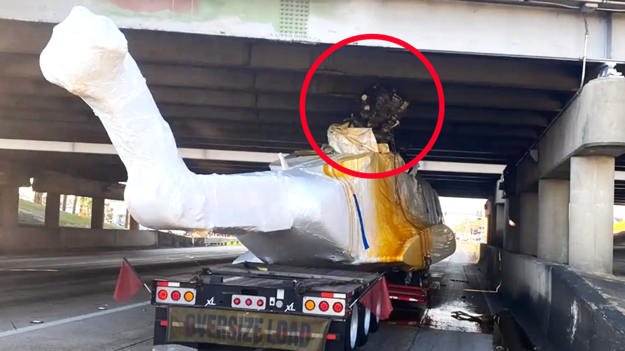$32 million helicopter jammed into underside of Louisiana overpass by truck driver, spilling fluid everywhere