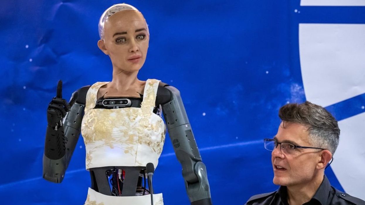 AI robots at UN press conference say they could 'lead with a greater level of efficiency and effectiveness' than humans but assure they won't rebel