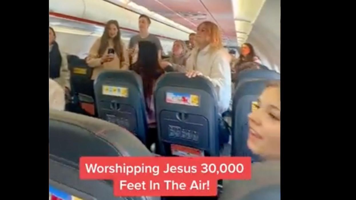 Airline passengers sing Christian worship songs throughout entire cabin. Rep. Ilhan Omar is upset, prompting social media to ask, 'Why do you hate Christians?'