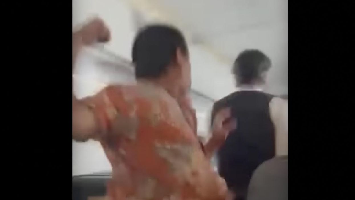 Airplane passenger punches flight attendant from behind in viral video. He'd just been told he couldn't use first-class lavatory.
