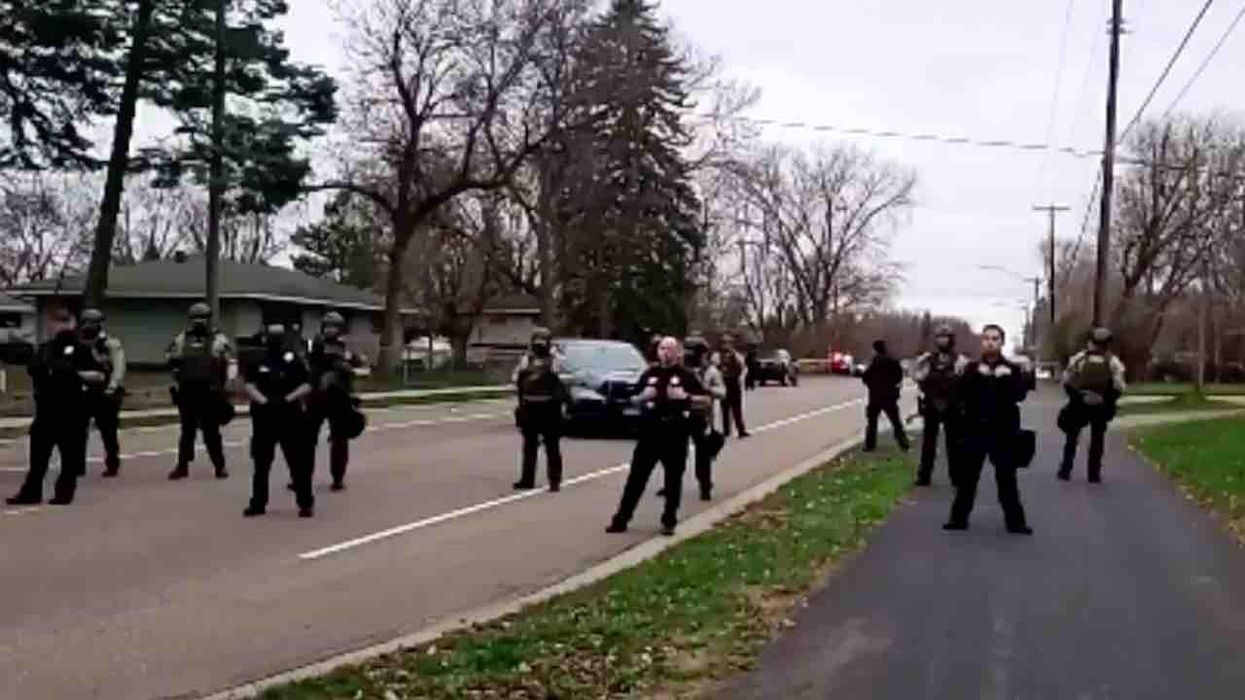 Anti-cop protester on bullhorn urges crowd to dox Minneapolis police, post photos of their families — and 'start doin' pull ups to their house'
