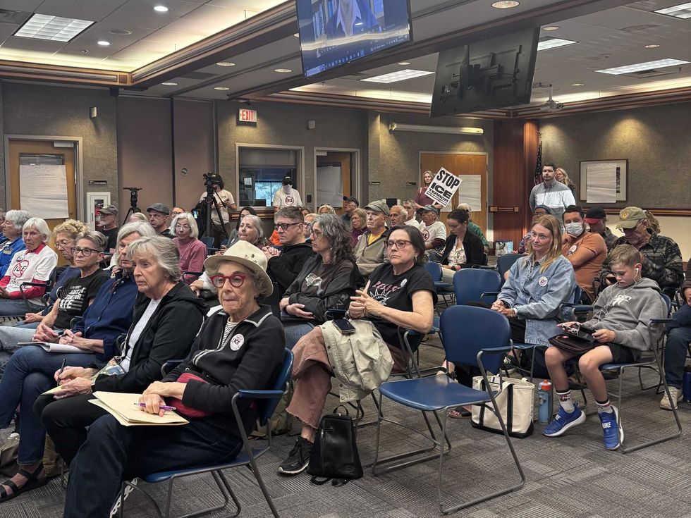 Anti-ICE activists affiliated with Indivisible Team of Southern Maine gather at Scarborough, Maine, town hall on Sept. 14, 2026.