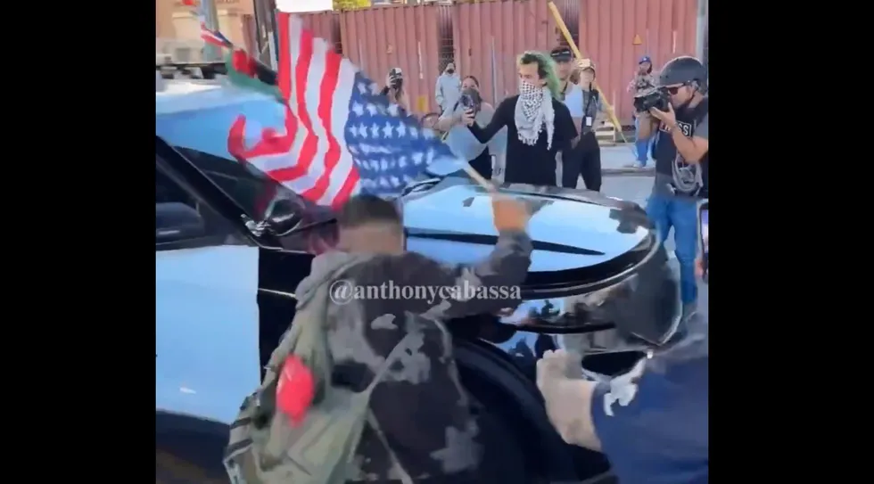 Anti-ICE agitator acts hurt after being 'ran over' by LAPD — but video shows the real story
