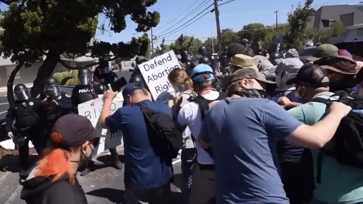 Antifa, radical leftists try to shut down 'straight pride' event. But cops in riot gear fire pepper-spray bullets at enraged, retreating counter-protesters.
