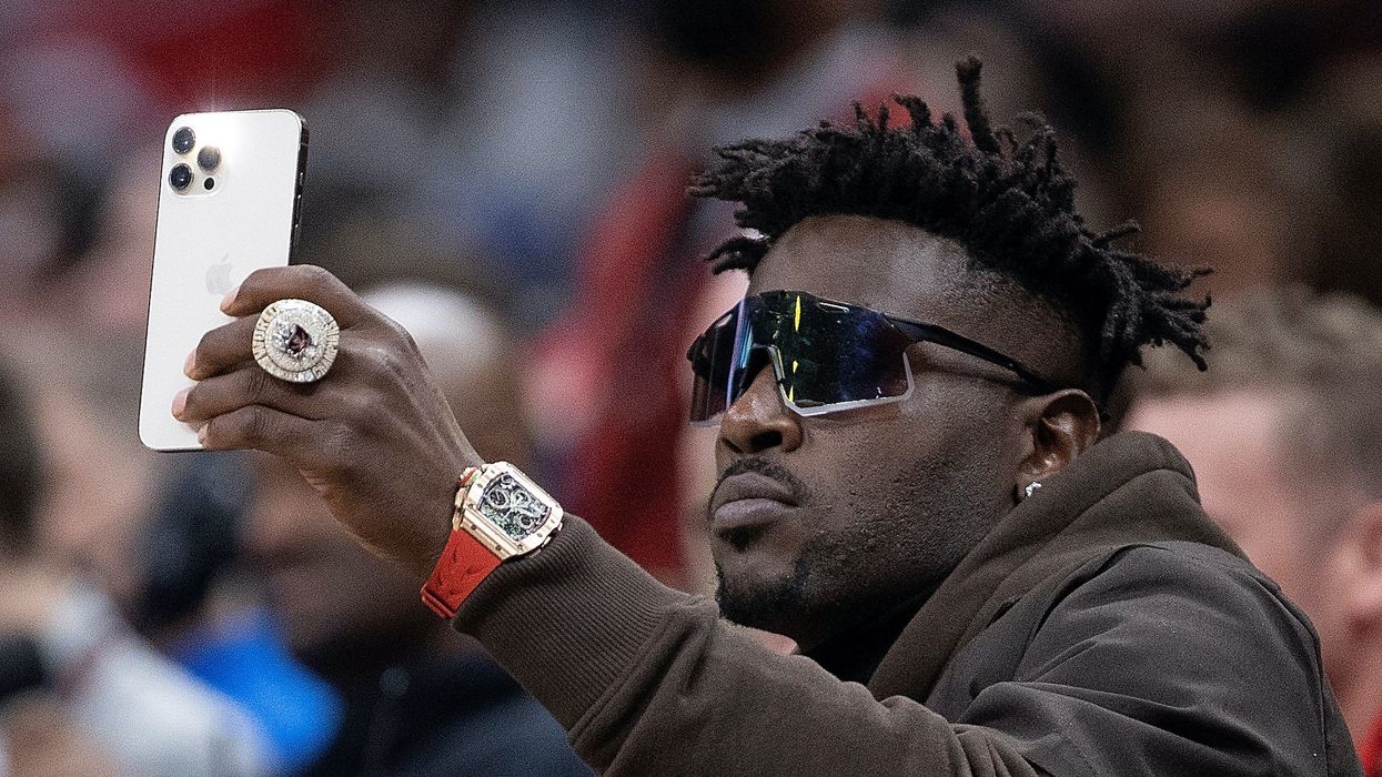 Antonio Brown wanted for attempted murder with a gun, but he's still posting on social media