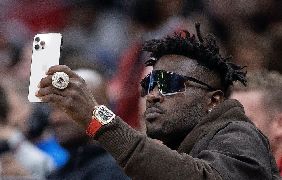 Antonio Brown wanted for attempted murder with a gun, but he's still posting on social media