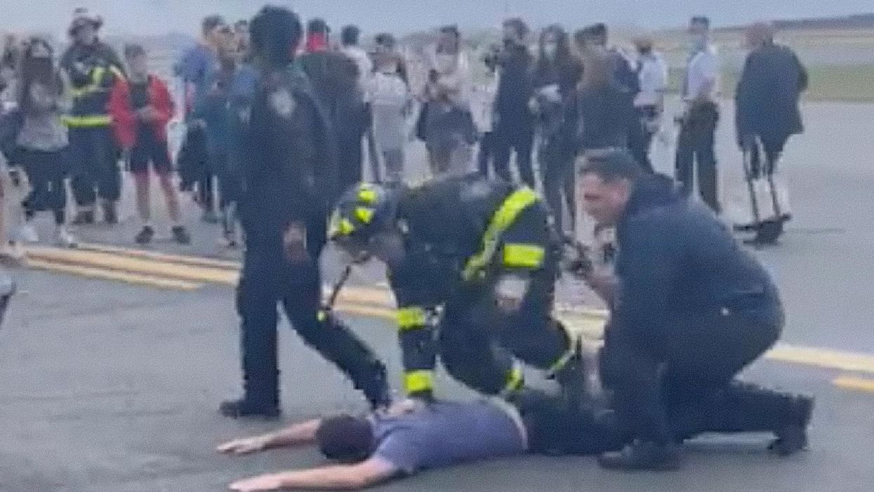 Authorities pin man to ground at LaGuardia airport after fellow passenger mistakes vintage camera for bomb