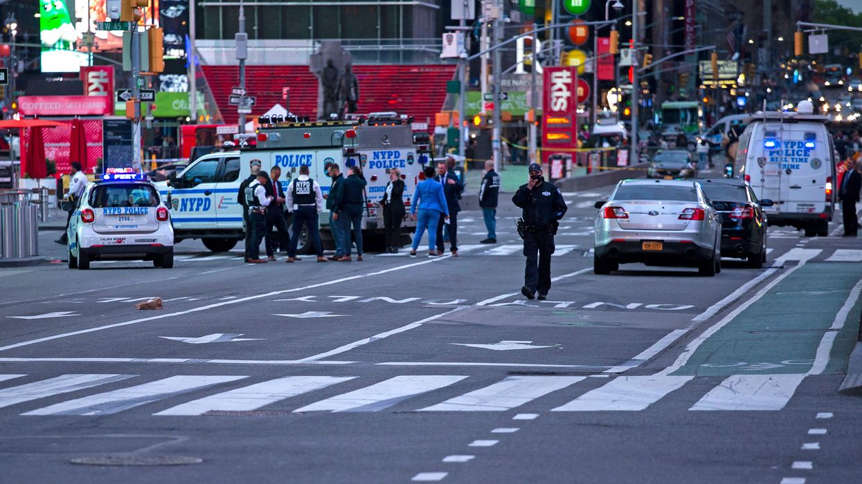 Authorities say a city worker was shot in broad daylight Manhattan over a family dispute; suspects remain at large