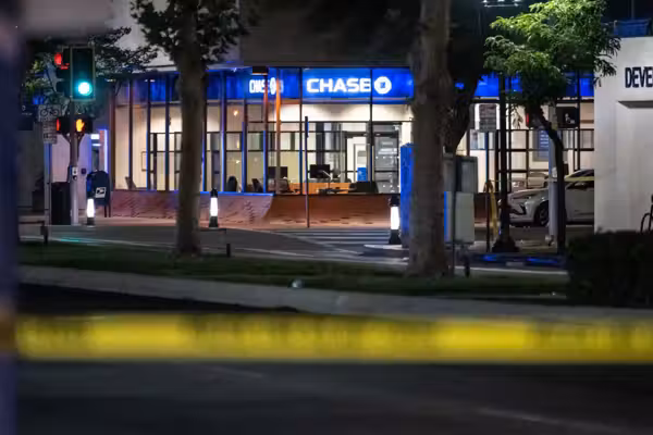 Bank customer armed with a gun turns the tables on alleged robber armed with a knife — permanently