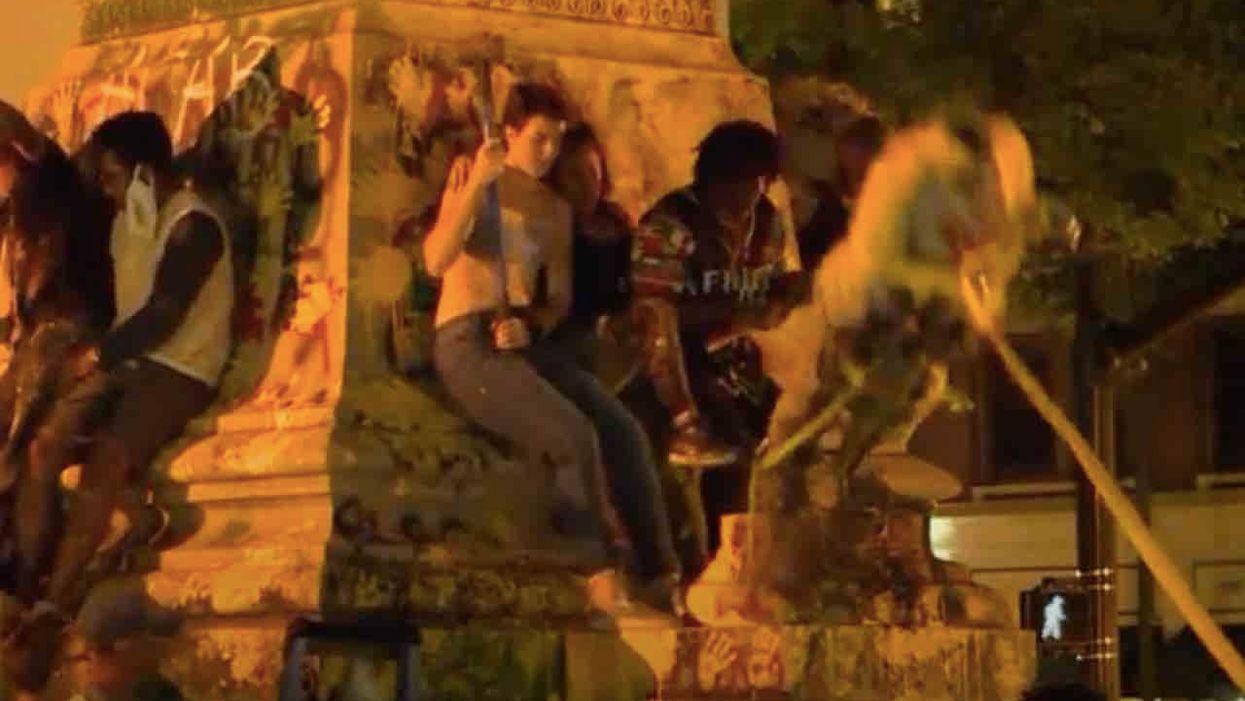 Beheaded Confederate statue is pulled down — and lands on protester's head, knocking him out