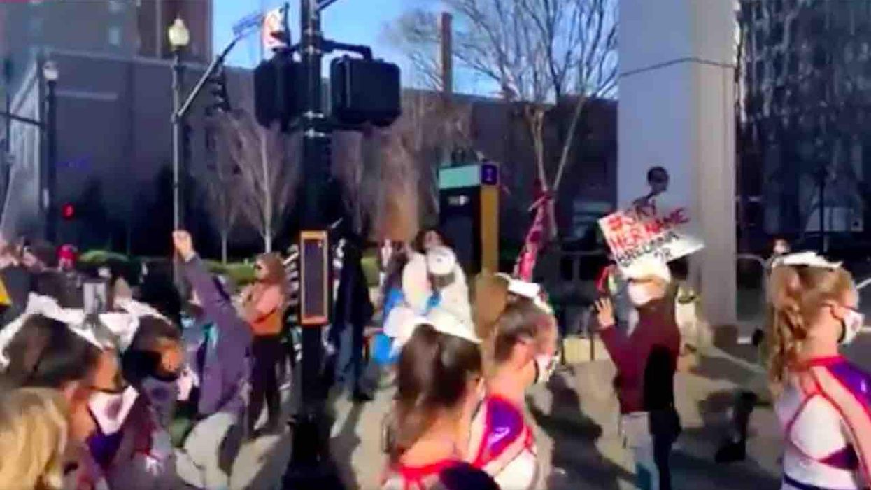 Black Lives Matter militants harass young girls for their 'white privilege' as they walk into cheerleading competition