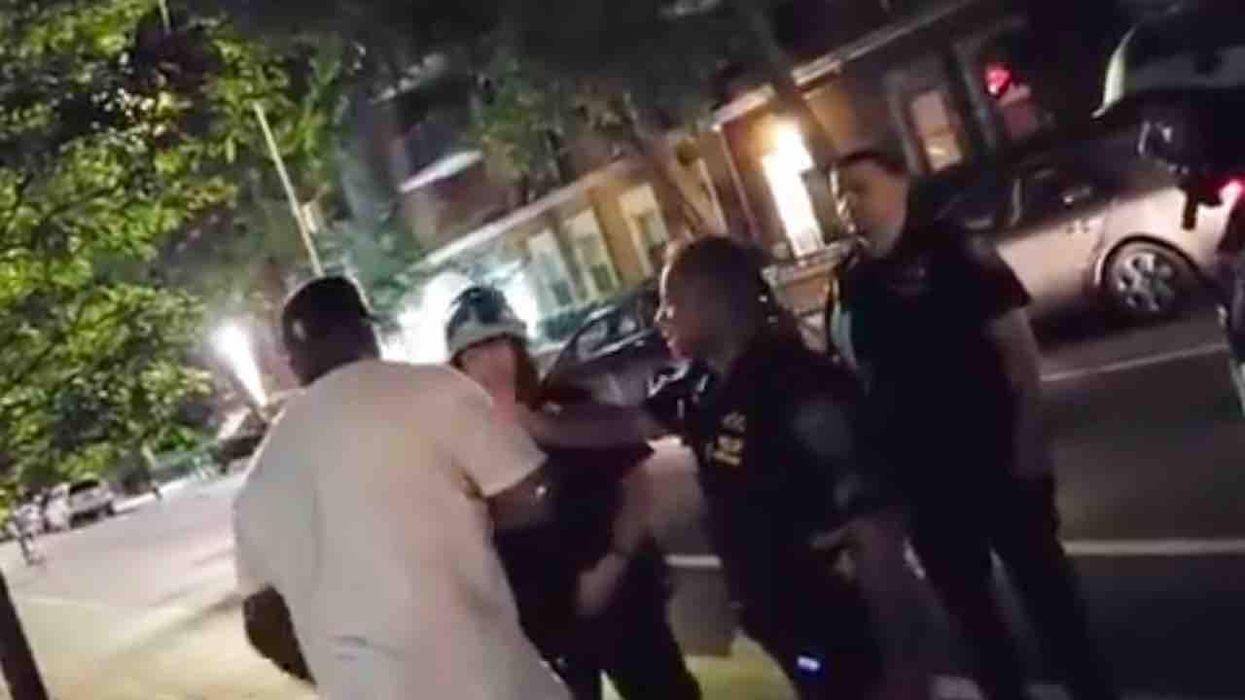 Black man repeatedly calls Asian police officer a 'f***in' ch**k' in unbridled tirade — and right in front of other NYPD cops