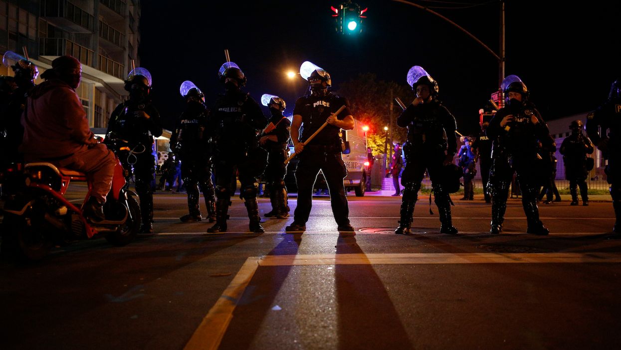 Buildings, vehicles vandalized on second night of Breonna Taylor protests, but no attacks on citizens or police after two cops were shot Wednesday