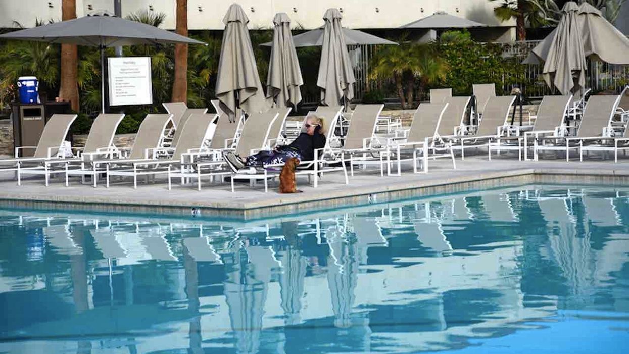 California county allows some swimming pools to reopen but only one person is allowed in water.