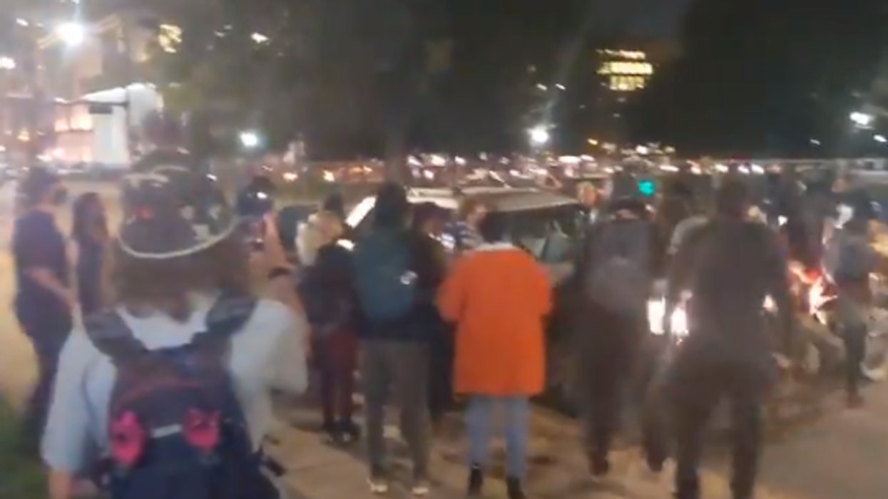 Car plows through crowd of Breonna Taylor protesters, Denver police detain driver