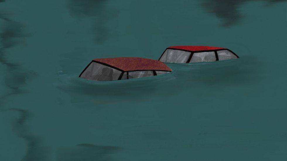Cars swept away by a flood.