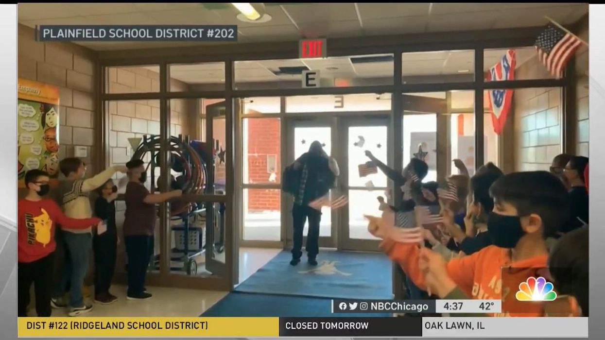 Cheering schoolchildren celebrate custodian after he becomes US citizen