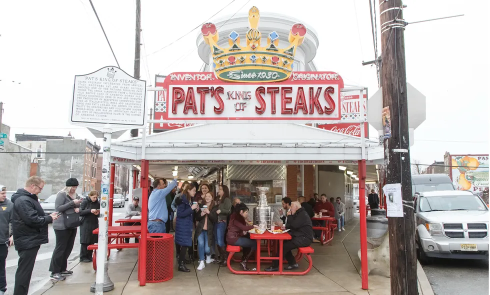 Cheesesteak scrap! Hooded punk caught on video chucking sandwich at manager of famous Philly cheesesteak stand. Yuge mistake.