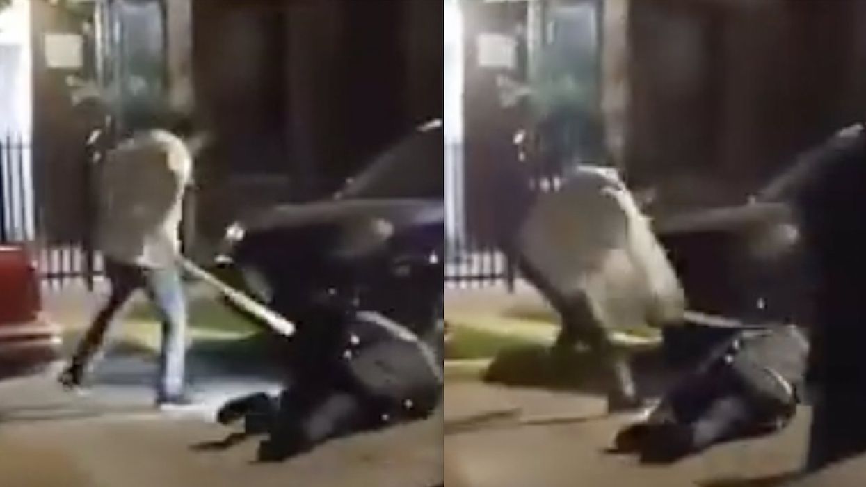 Chicago cop bashed in back of head with wooden flagpole as he lies face-down in street