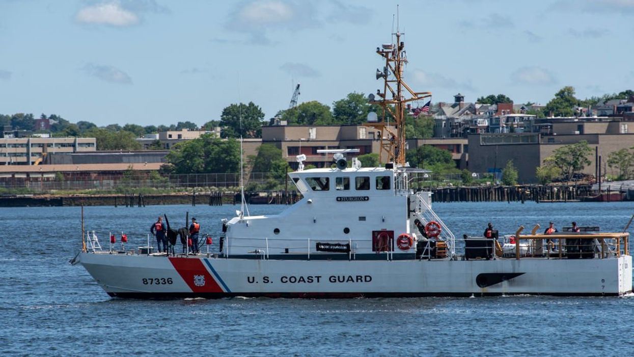 Coast Guard stops migrant boat, arrests 3 suspected criminal gang members wanted for deadly shooting
