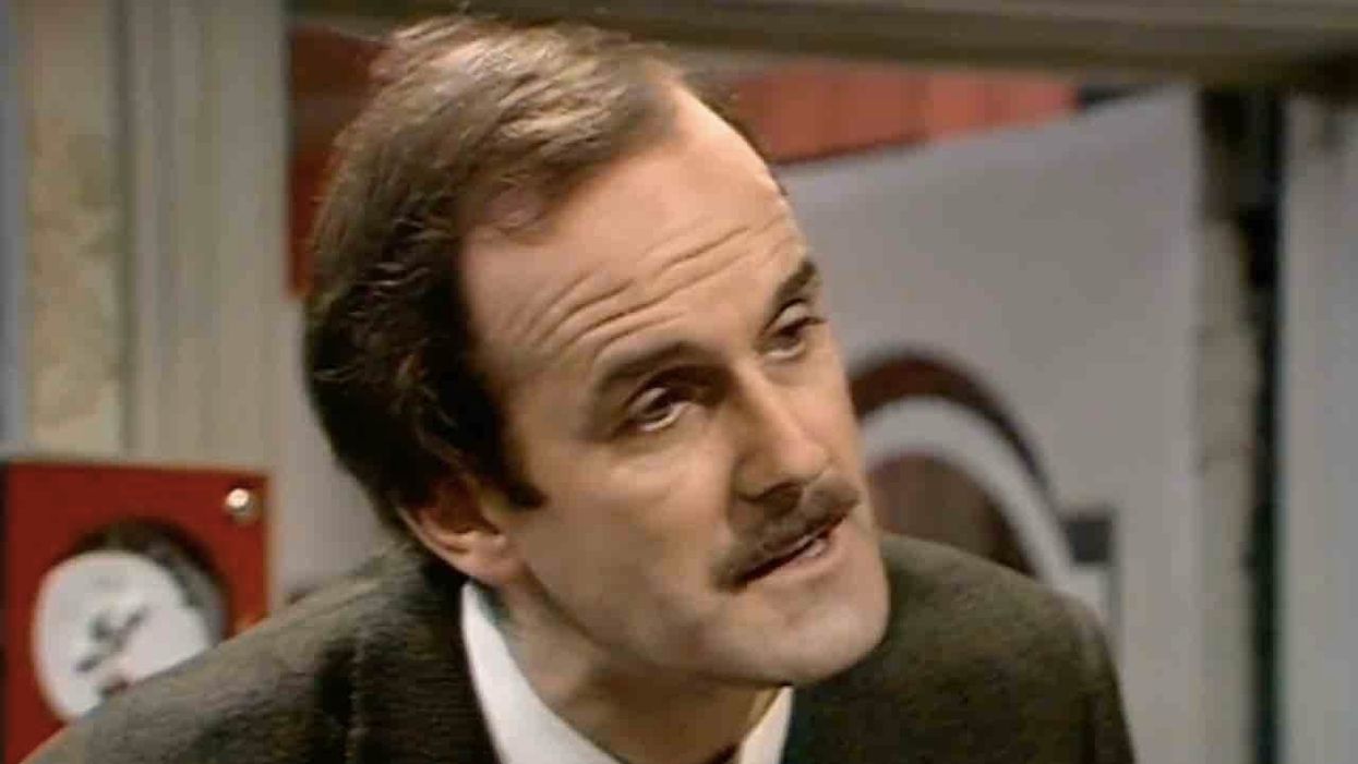 Comedy legend John Cleese blasts 'cowardly and gutless' decision to remove 45-year-old sitcom episode over racial slurs