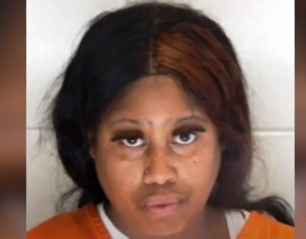 Cop hauled away to jail in her police cruiser after she allegedly stole a pair of shoes — while in uniform