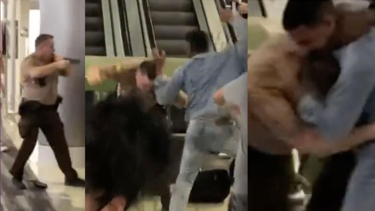 Cop pulls gun on mob during Miami airport brawl; passenger who lost it over delayed flight had just bitten officer's head, police say