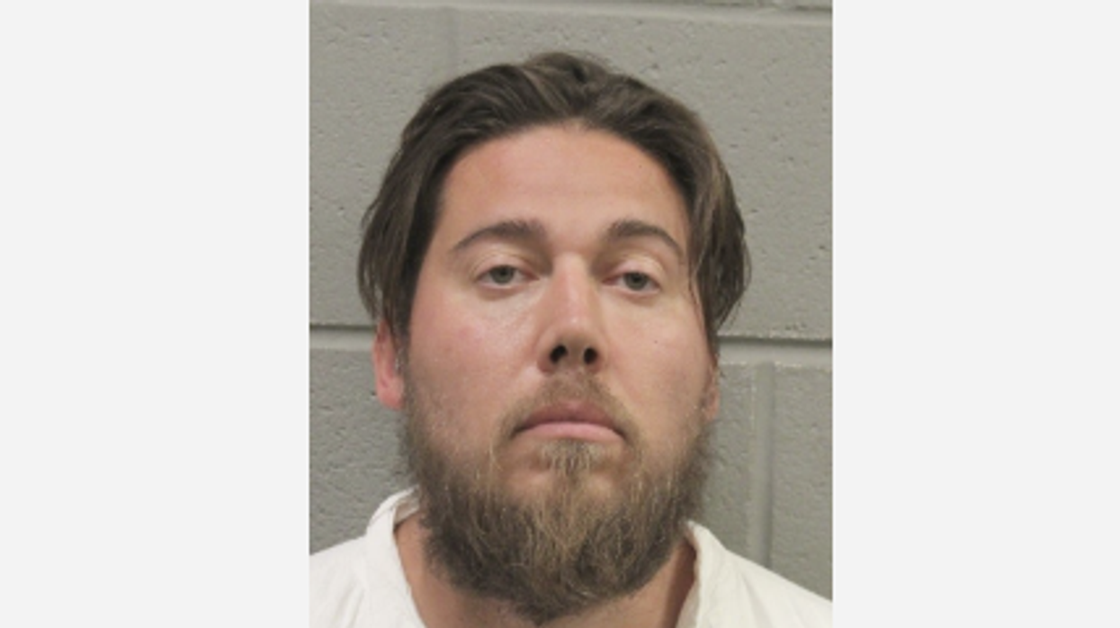 Cops catch man drenched in blood after he allegedly bludgeoned wife to death with clothing iron, dumped her dogs on freeway