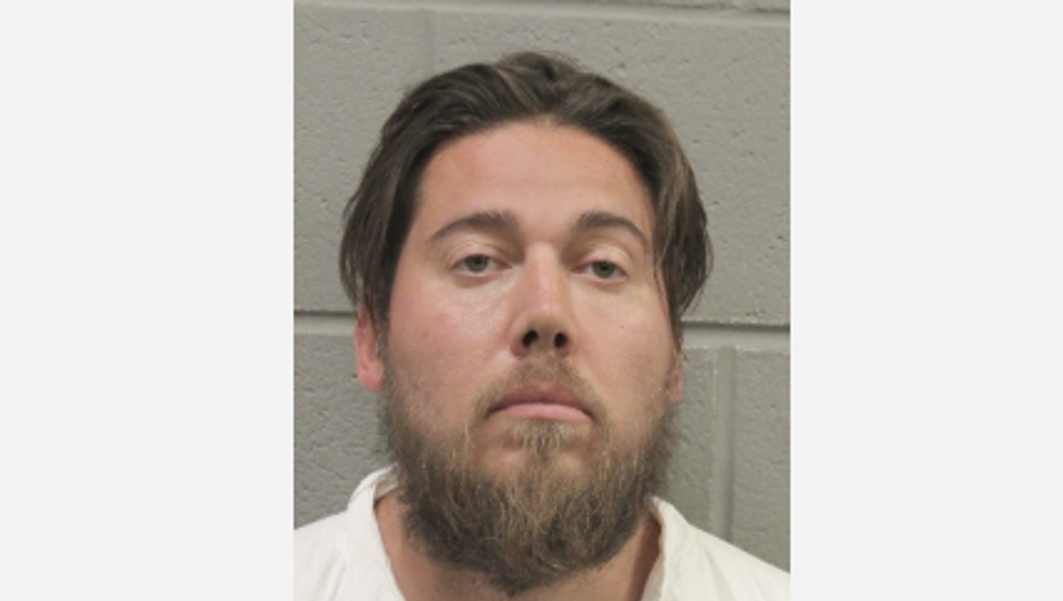 Cops catch man drenched in blood after he allegedly bludgeoned wife to death with clothing iron, dumped her dogs on freeway