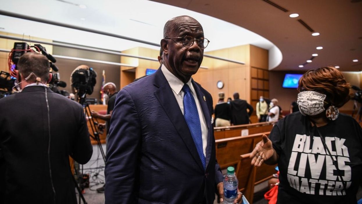 DA says Brooks wasn't a threat when he shot Taser at cops. But he said a Taser is 'a deadly weapon.'