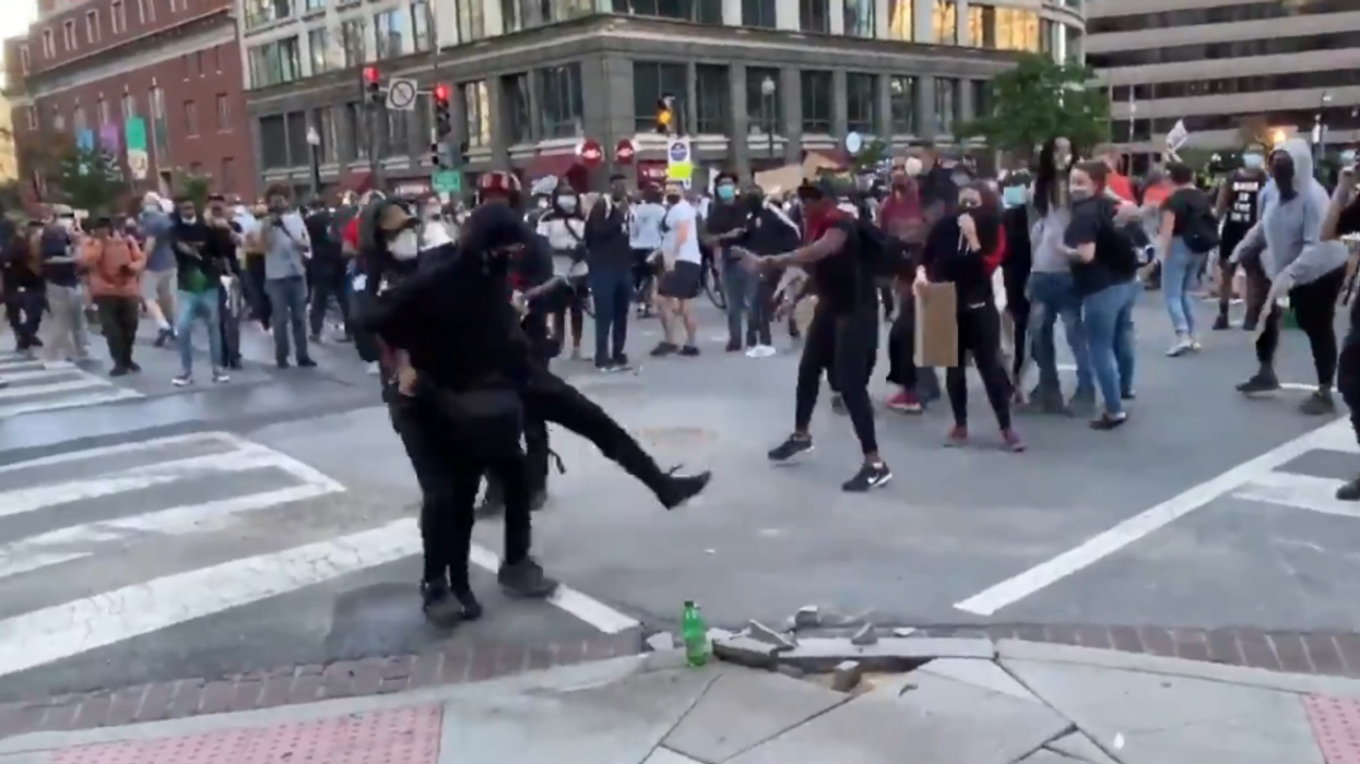 DC rioter causing damage is dragged over and handed to the police by other protesters