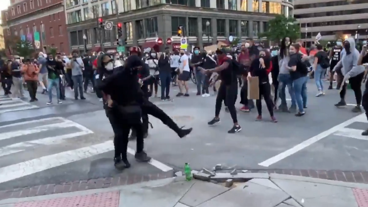 DC rioter causing damage is dragged over and handed to the police by other protesters