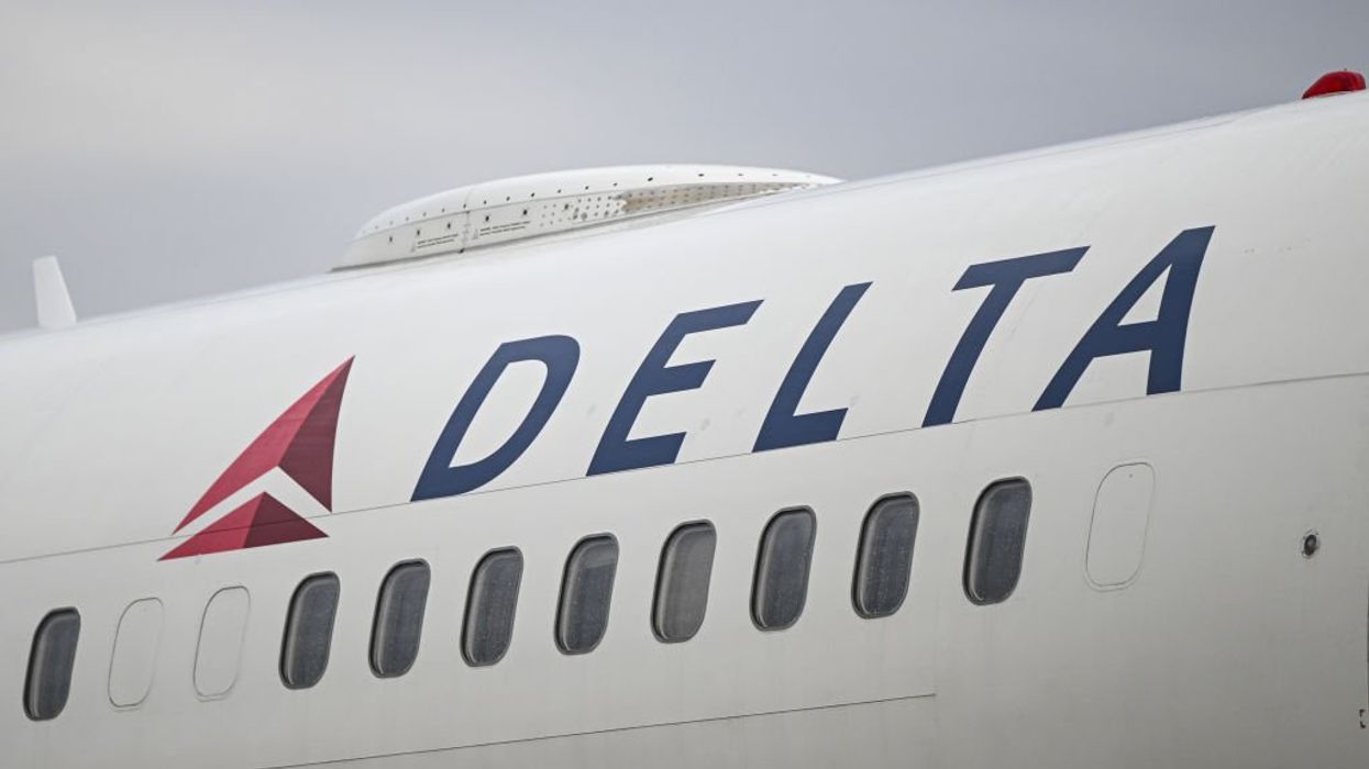 Delta passenger opens airplane door before takeoff, goes down emergency slide, gets arrested