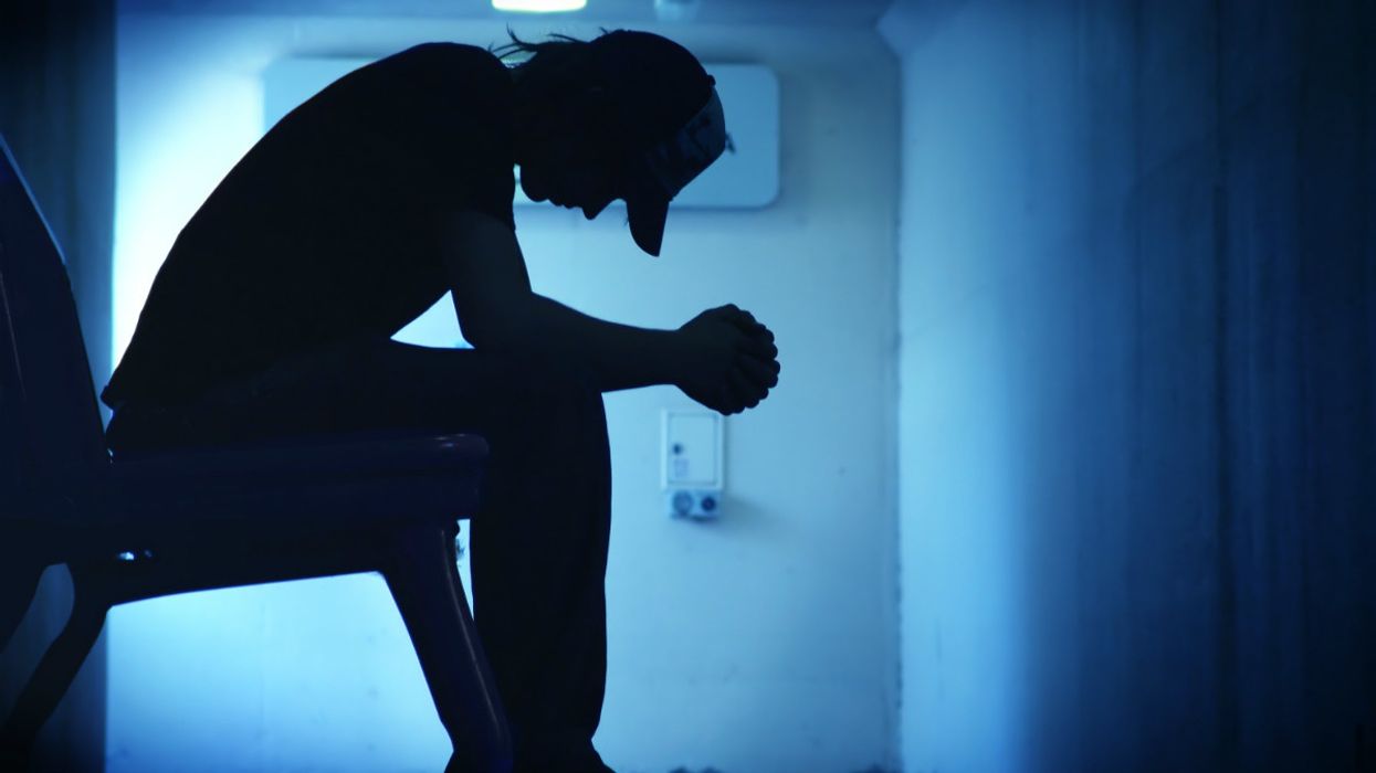 Depressed young man in silhouette