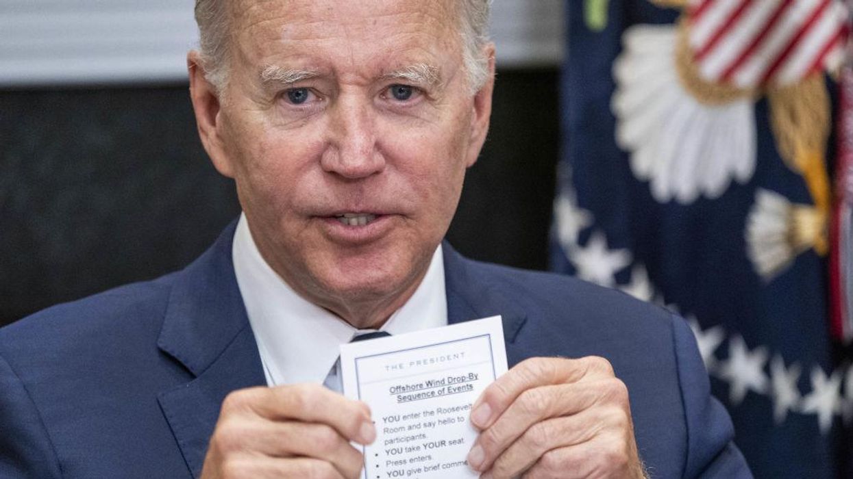 'Disturbing': Biden accidentally shows note card that instructs the president to do simple tasks such as 'take YOUR seat'