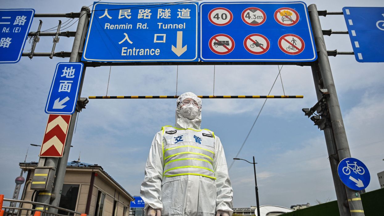 Disturbing viral video shows elderly Shanghai man taken away in a body bag — while still alive