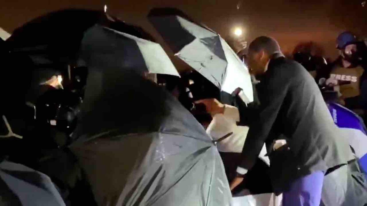 'Don't you dare start this s**t!': Lone man furiously stands up to mob of left-wing militants gathered in front of police in Brooklyn Center