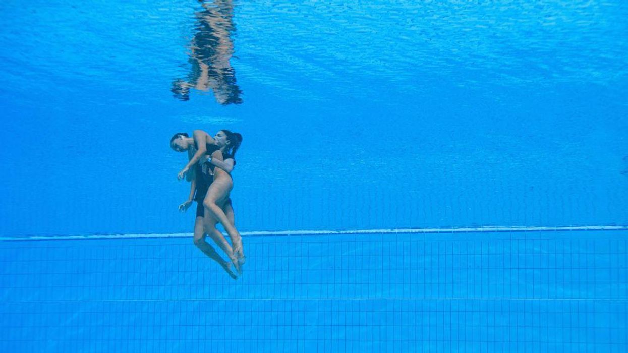 Dramatic photos capture the moment Team USA swimming coach heroically saves unconscious swimmer