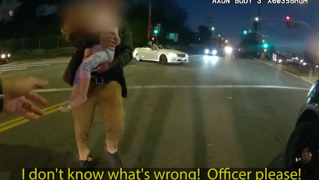 Dramatic video shows father on his knees begging as hero cop saves his choking baby's life: 'Officer, please!'