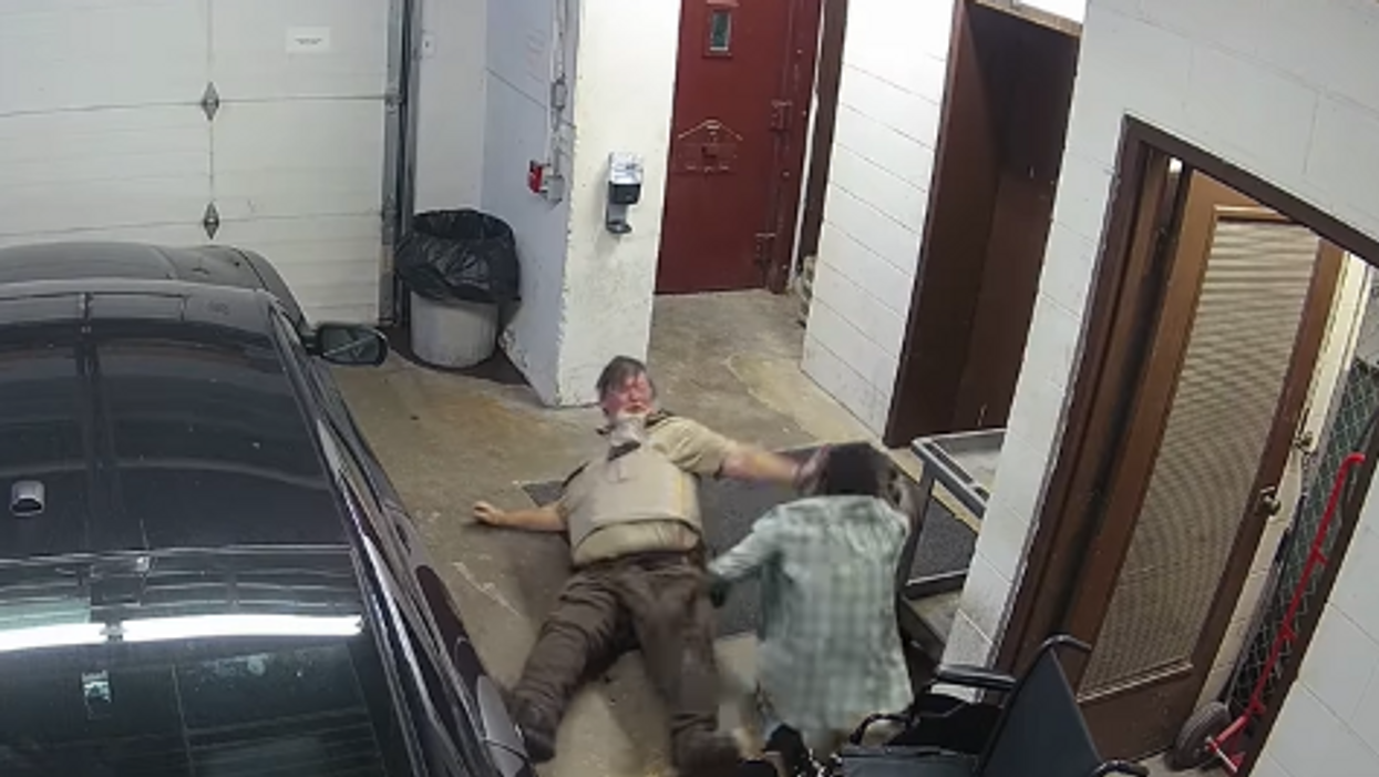 Dramatic video shows inmate in wheelchair wrestle gun away from correctional officer in courthouse, only to be shot by another guard