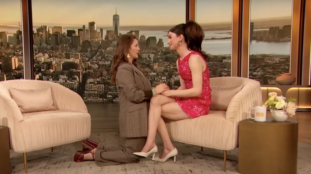 Drew Barrymore gets on her knees in front of trans activist Dylan Mulvaney, who told TV host of 'hatred' toward 'trans community.' Then they hug — and the crowd loves it.