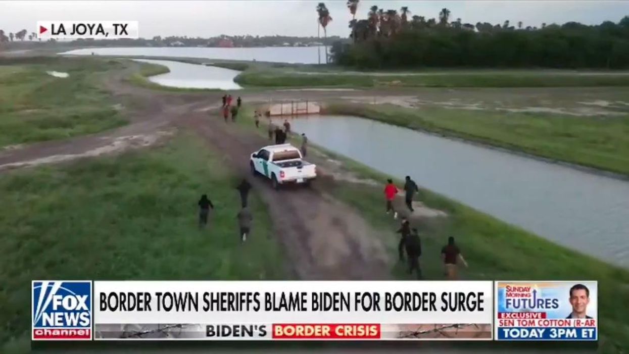 Drone video shows dozens of illegal aliens rushing outnumbered Border Patrol agents in mad dash into Texas