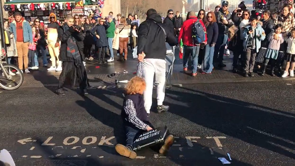 Evidently tired of having his city immobilized by vegetarian climate alarmists, vigilante single-handedly dismantles barricade