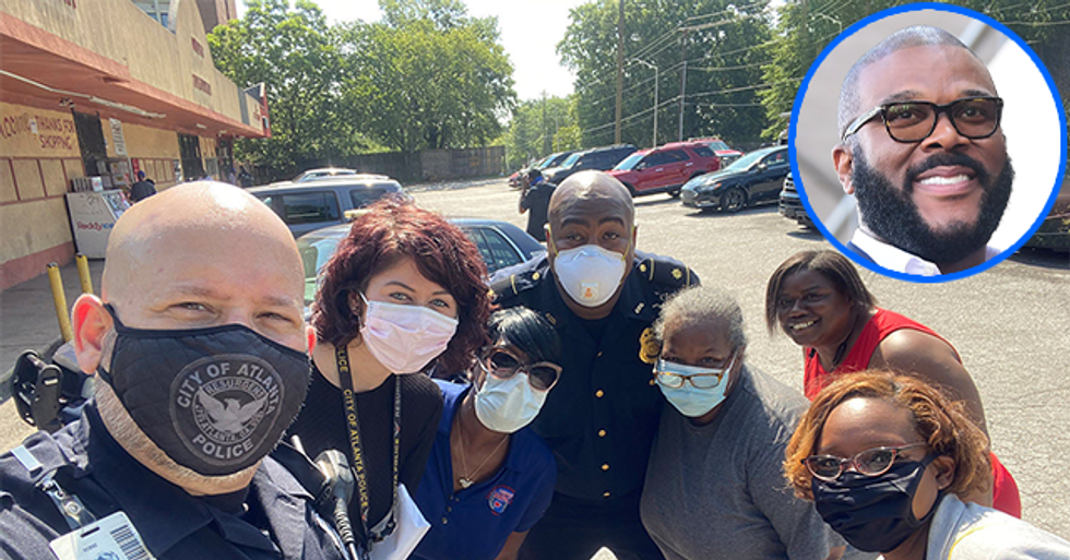 Watch: Atlanta Police Give Residents Kroger’s Supermarket Gift Cards Donated by Tyler Perry