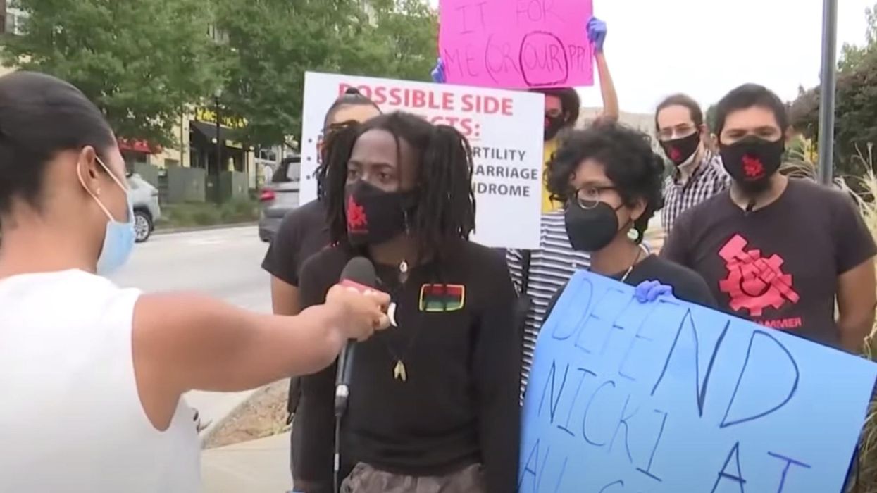 Fans of rapper Nicki Minaj protest against vaccine mandates outside the CDC headquarters in Atlanta