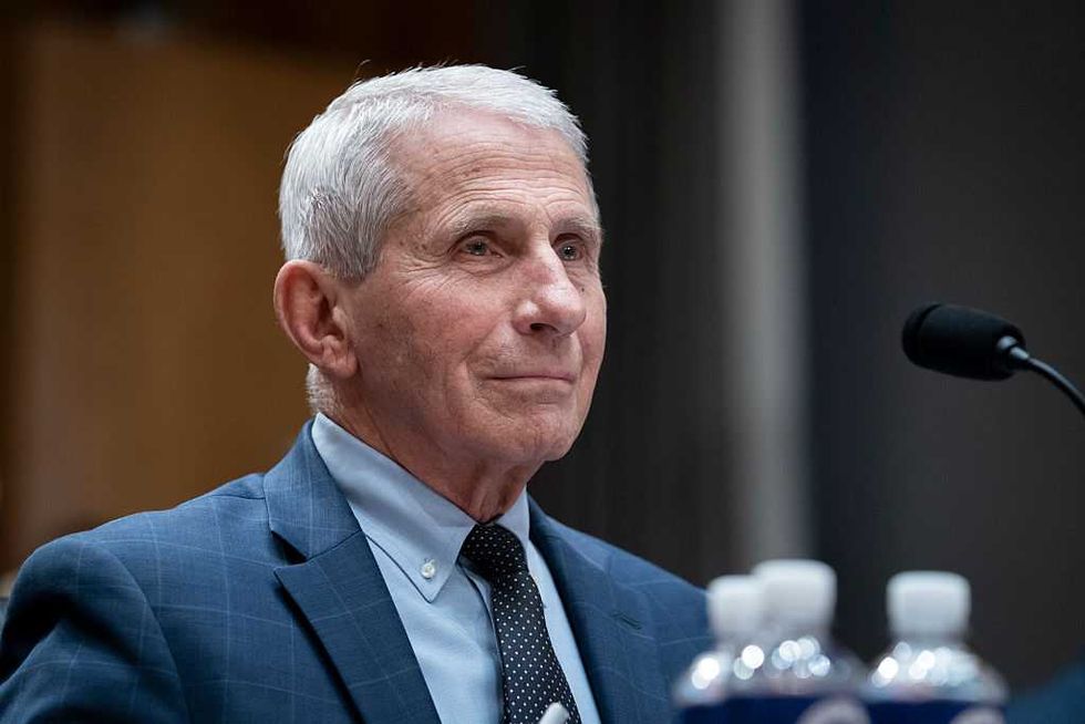 Fauci mistook the microphone for a throne