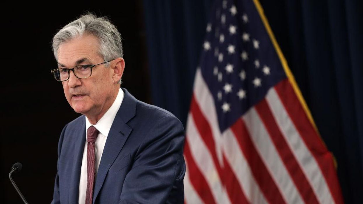 Fed chairman says inflation is 'much too high,' is prepared to address it through continued rate hikes