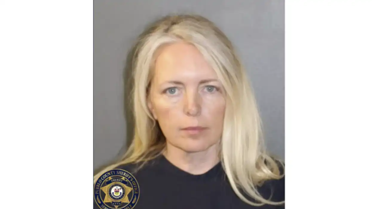 Female arrested after her dementia-stricken mother, 76, was mauled to death in home with 54 dogs