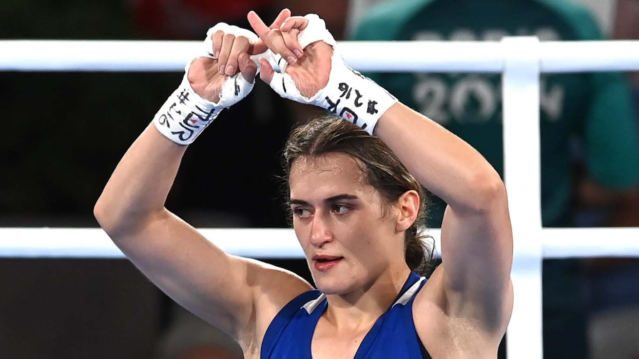 Female Olympic boxer makes 'X' symbol in apparent protest after semifinal loss to opponent embroiled in gender controversy