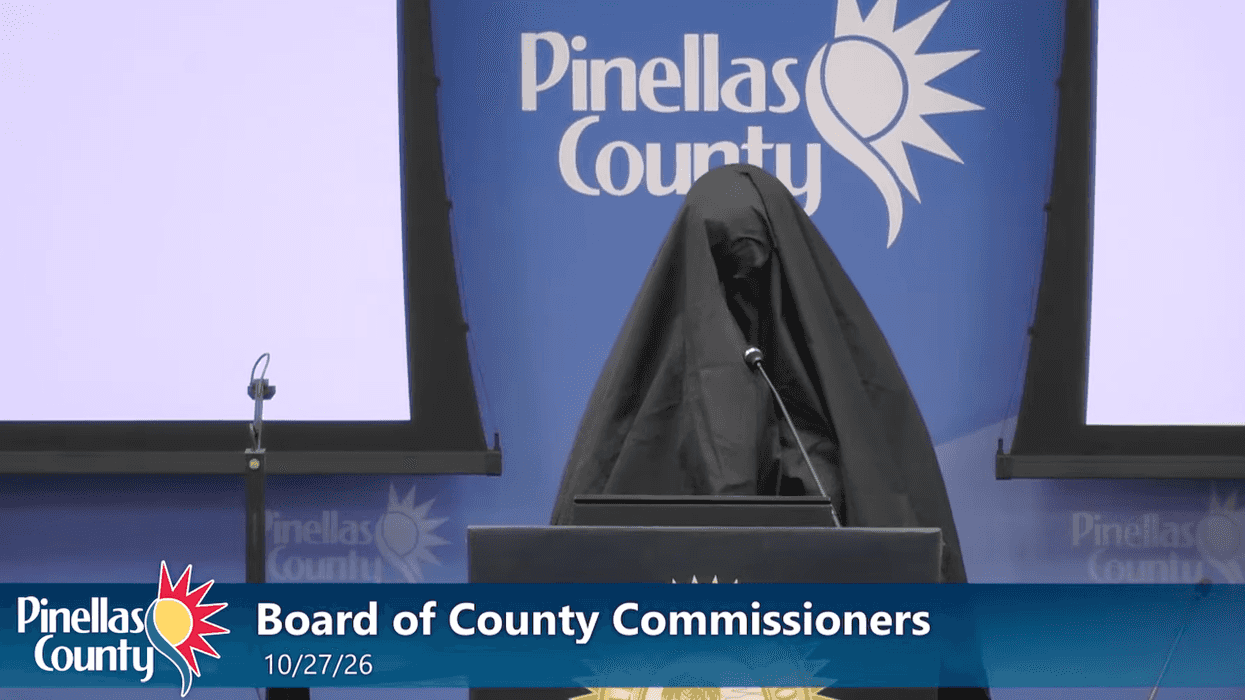 Female wearing Muslim burqa stands at mic during Florida public meeting, reports say. What she does next gets her kicked out.